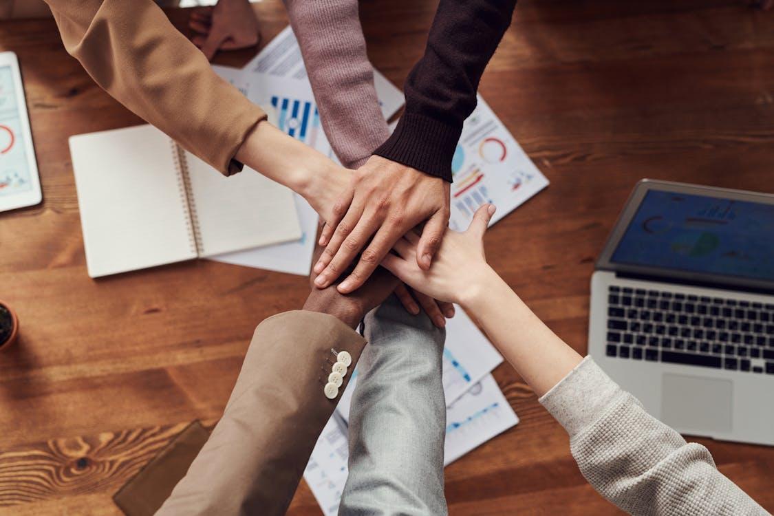 Free Photo Of People Near Wooden Table Stock Photo