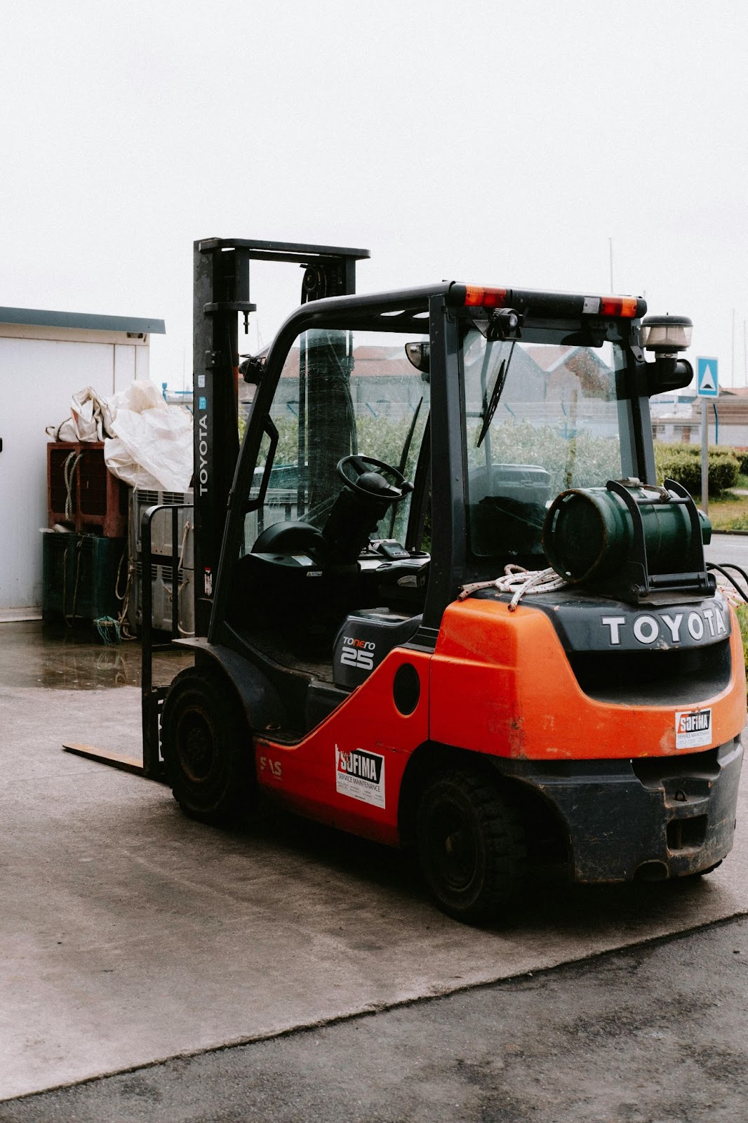 An orange Toyota forklift parked outdoors