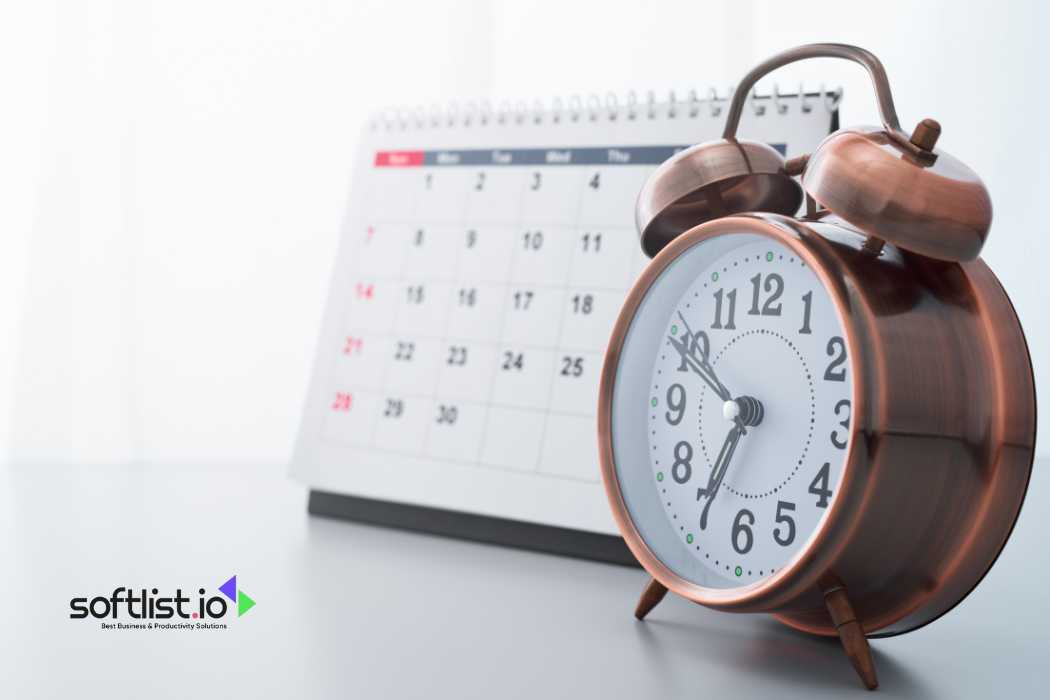 Alarm clock and calendar on white background