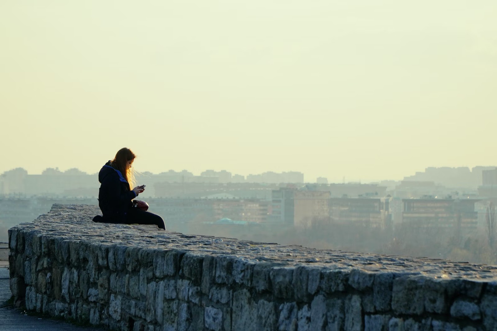 Girl sitting alone - What Is Off-Grid Living