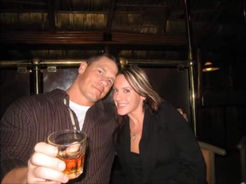 Elizabeth Huberdeau and John Cena having a drink