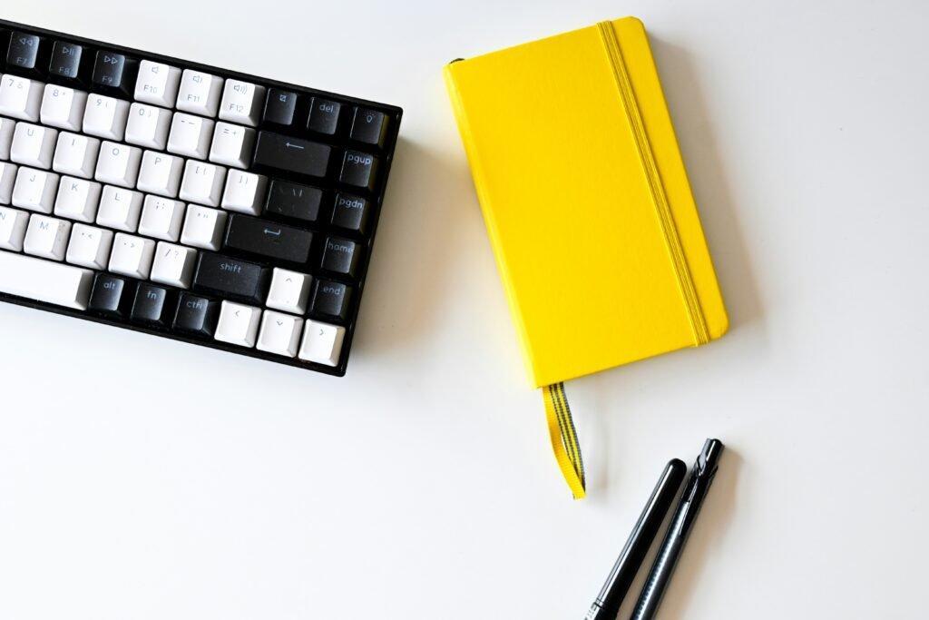 keyboard and notebook with pen - How To Learn Fast For Exam