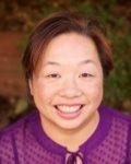 A person smiling for the camera

Description automatically generated with medium confidence