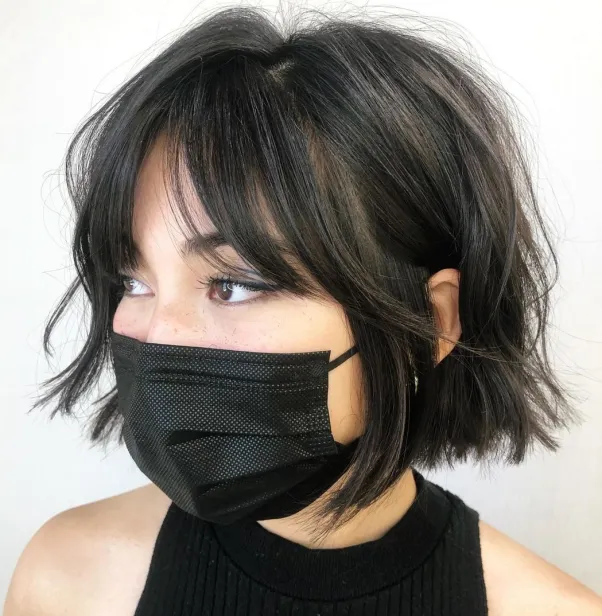 Picture of a girl rocking her Curtain Bangs with Short Hair