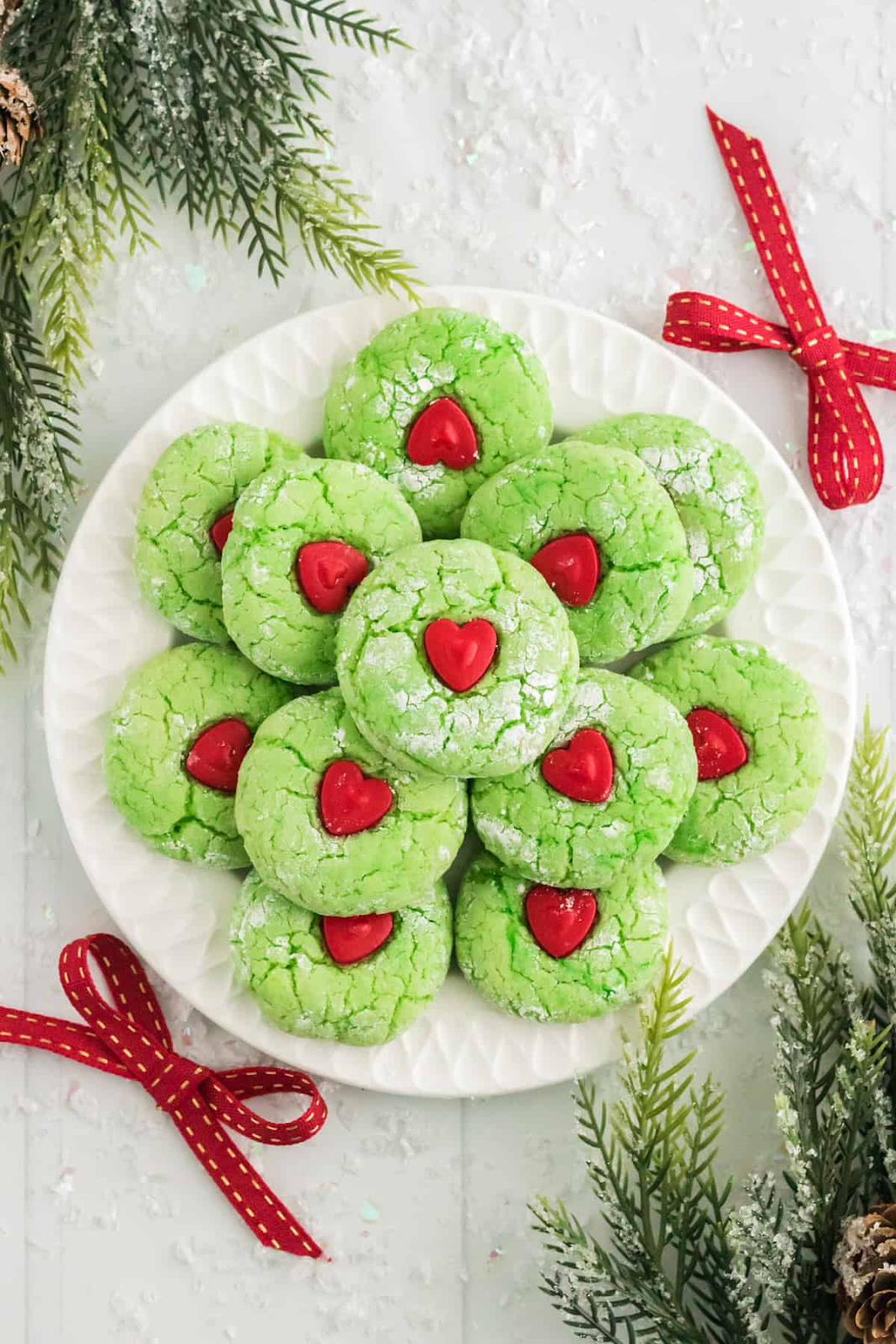 frinch cake mix cookies on white plate with red bow and evergreen