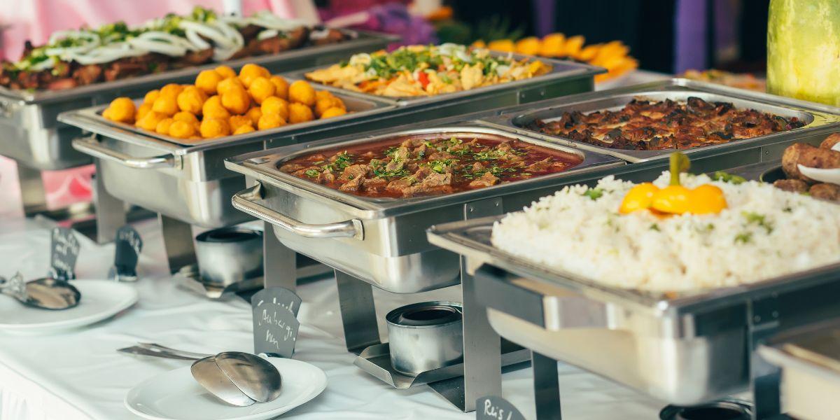 A buffet table full of food

Description automatically generated