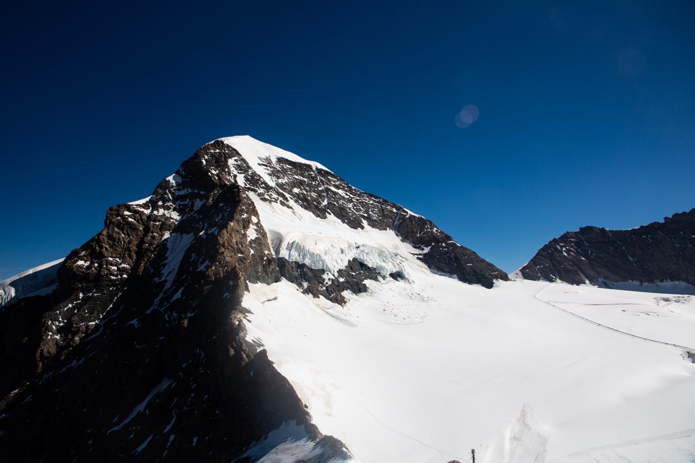 A mountain with snow on it

Description automatically generated