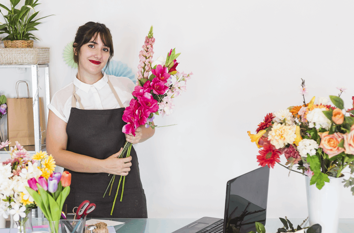 florist making a gorgeous flowers bouquet