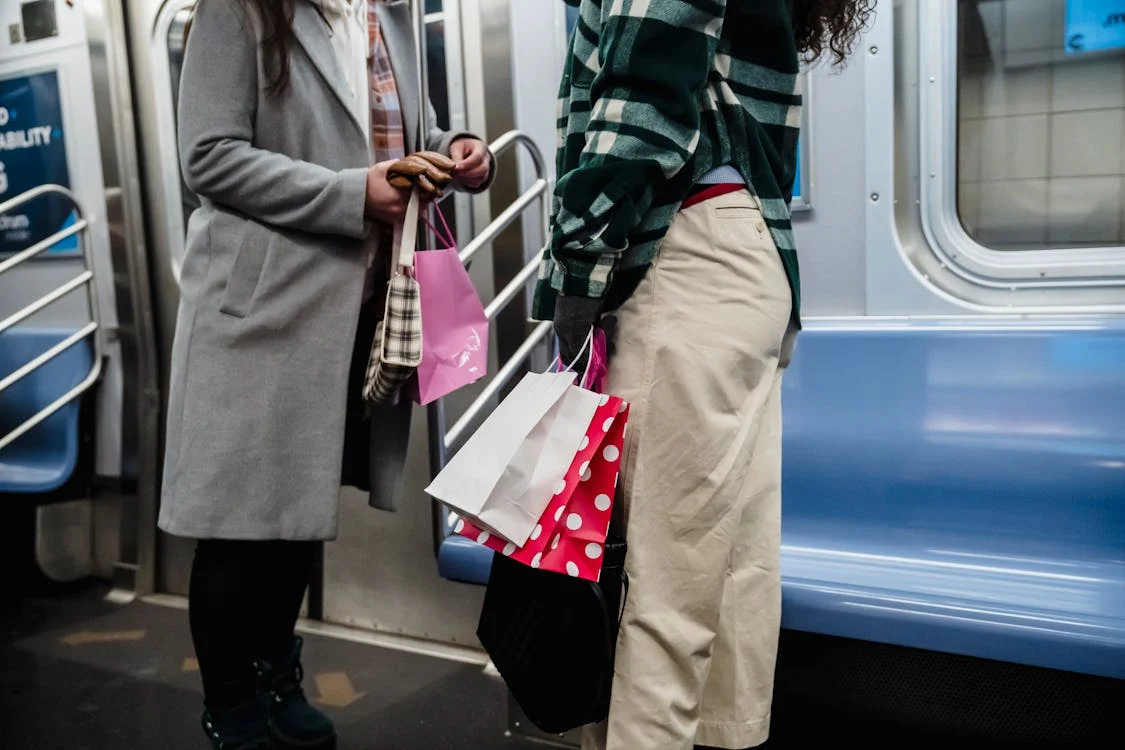 Two people riding on the subway 