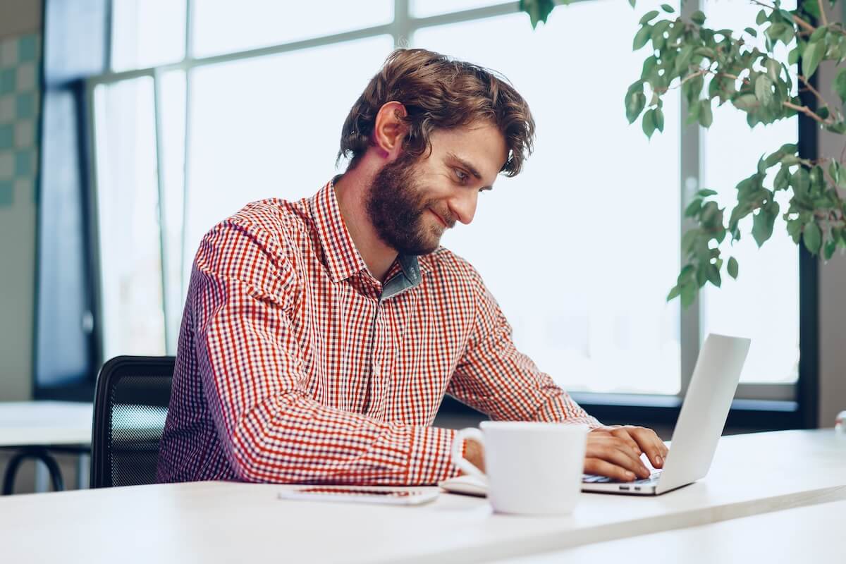 Non profit organization challenges: employee using a laptop