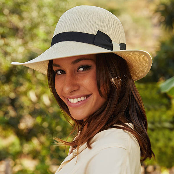 Lady shows off her  panama hat and slays while at it