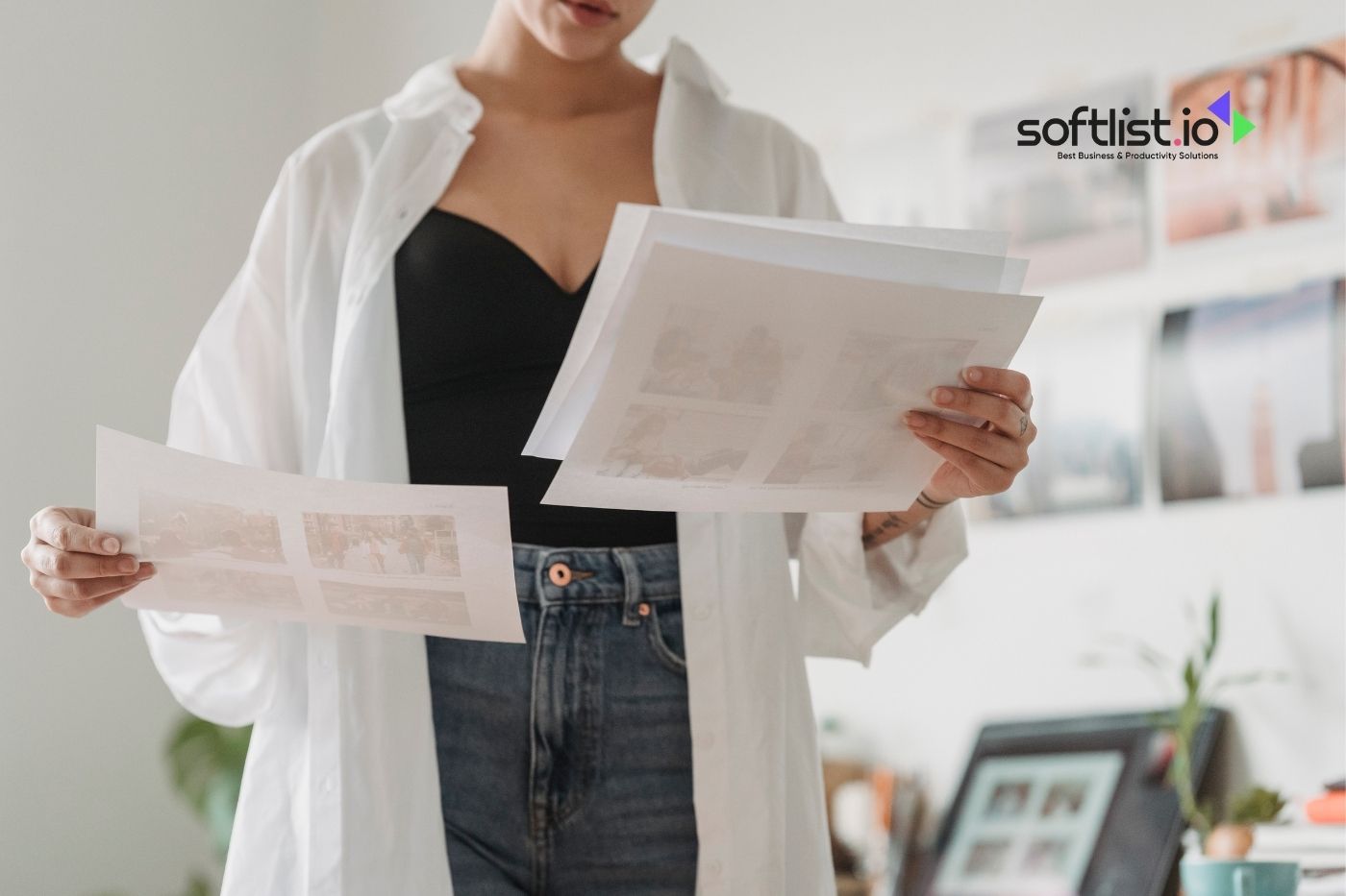 Woman examining printouts with softlist.io logo in a bright office