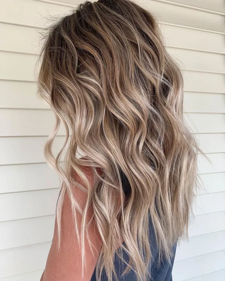 Gorgeous picture of a lady with sandy Balayage