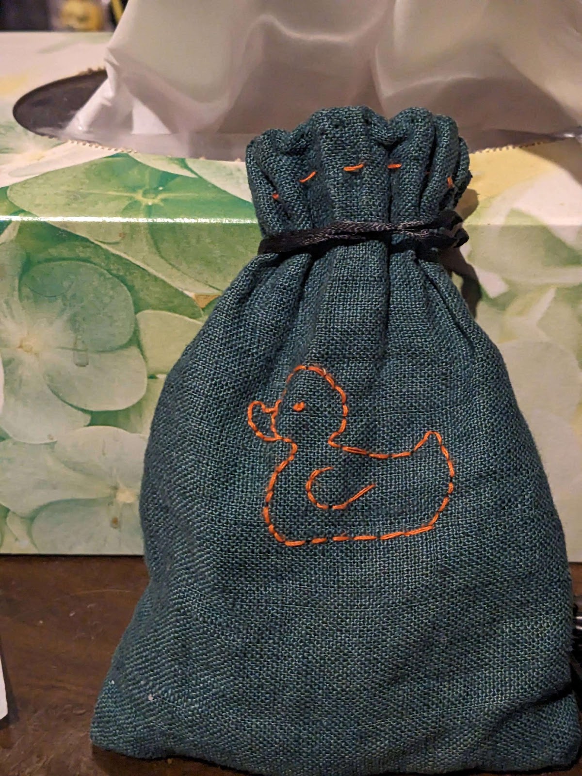 A bag with a duck on it

Description automatically generated