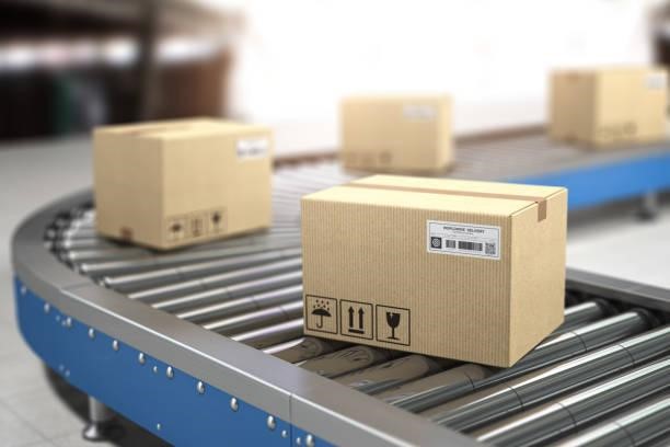 Сardboard boxes on conveyor in warehouse. Delivery, storage and distribution service concept. Сardboard boxes on conveyor in warehouse. Delivery, storage and distribution service concept. 3d illustration belt conveyoras stock pictures, royalty-free photos & images