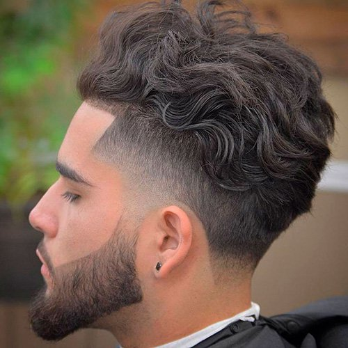 Side profile of a guy rocking the curly hiaircut