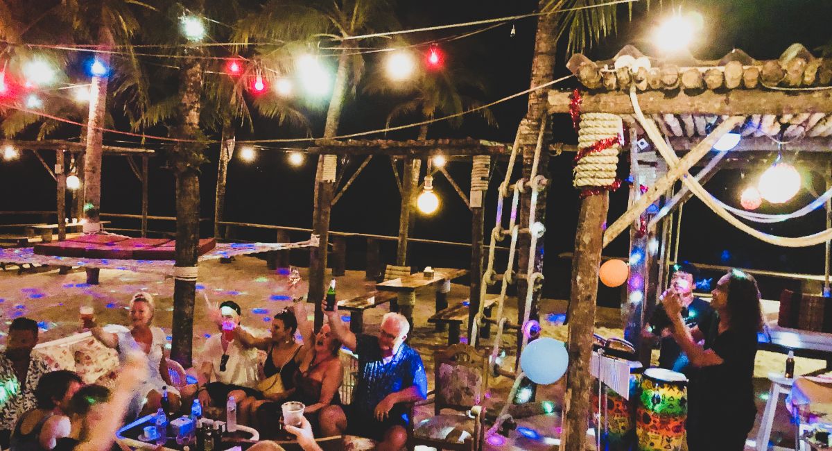 group of visitors cheering with their drinks 