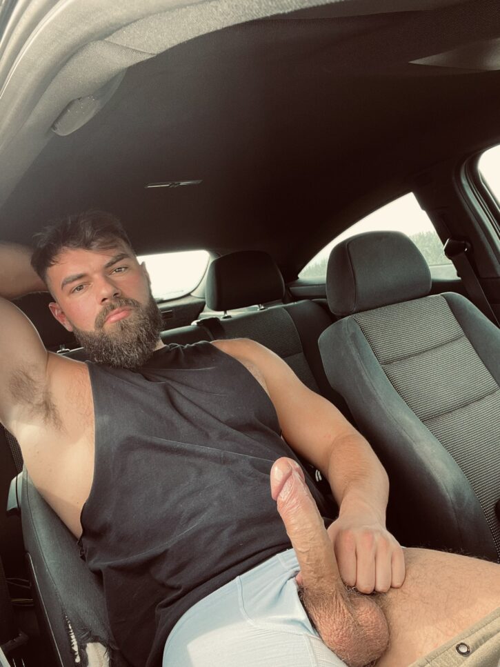 alpha bayton lying down in the passenger side of his best friends ride in a black tank top and his huge erect dick pulled out of his white gym shorts