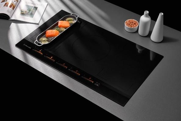 A black stove top with food on it

Description automatically generated