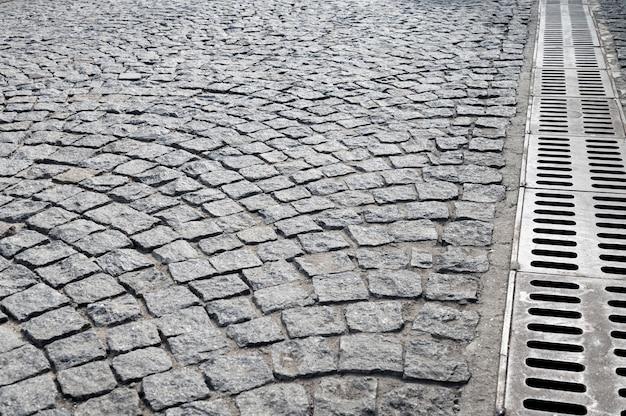 Outdoors cobblestone texture with drainage