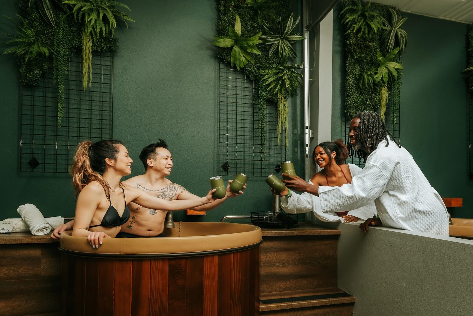 four people at Oakwell Beer Spa taking beer bath