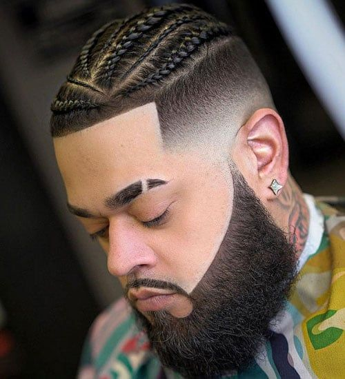 Braids For Men: Picture of a guy rocking gorgeous braids with a well groomed beard