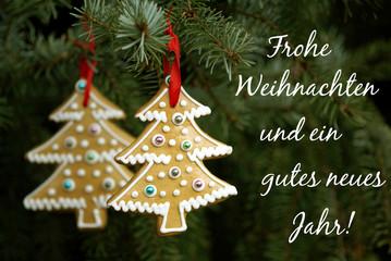 "Frohe Weihnachten und ein gutes neues Jahr" - Weihnachtskarte mit Schrift, Lebkuchenanhängern und Weihnachtsbaum