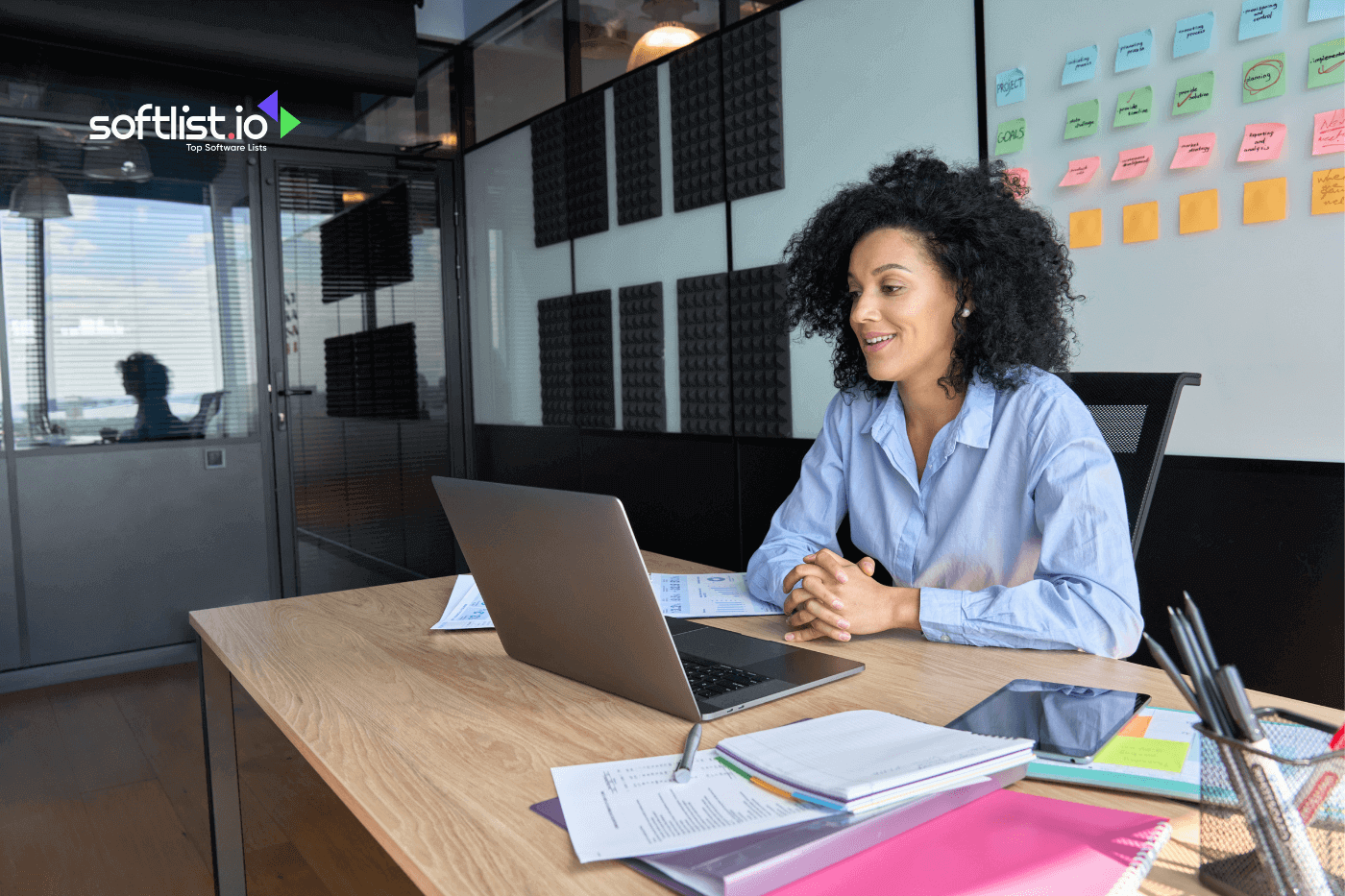 a woman facing her laptop