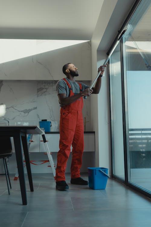 Free Man Cleaning the Windows Stock Photo