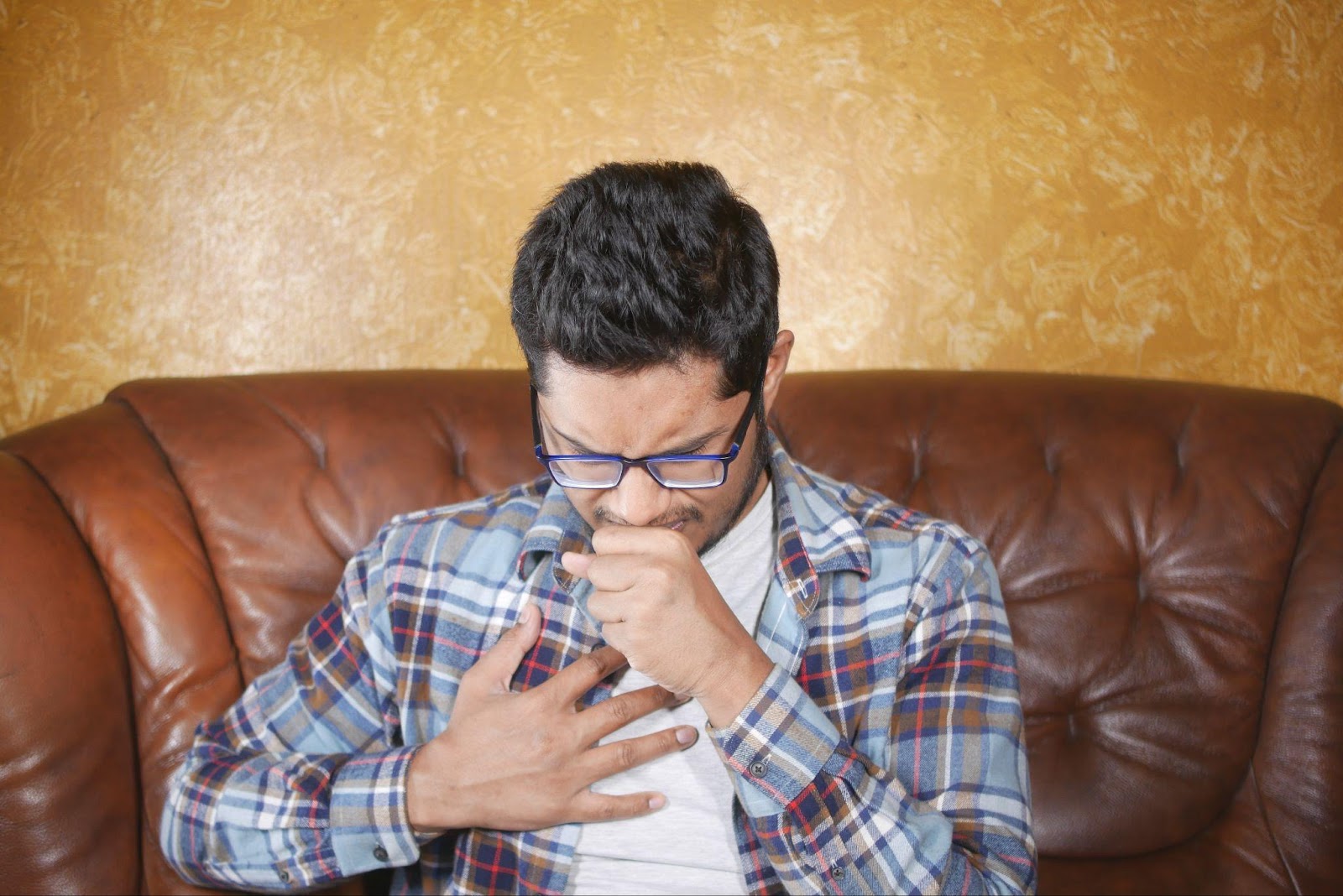 a man coughing