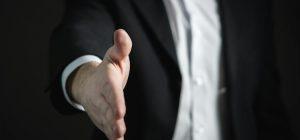 A businessman holding an open hand