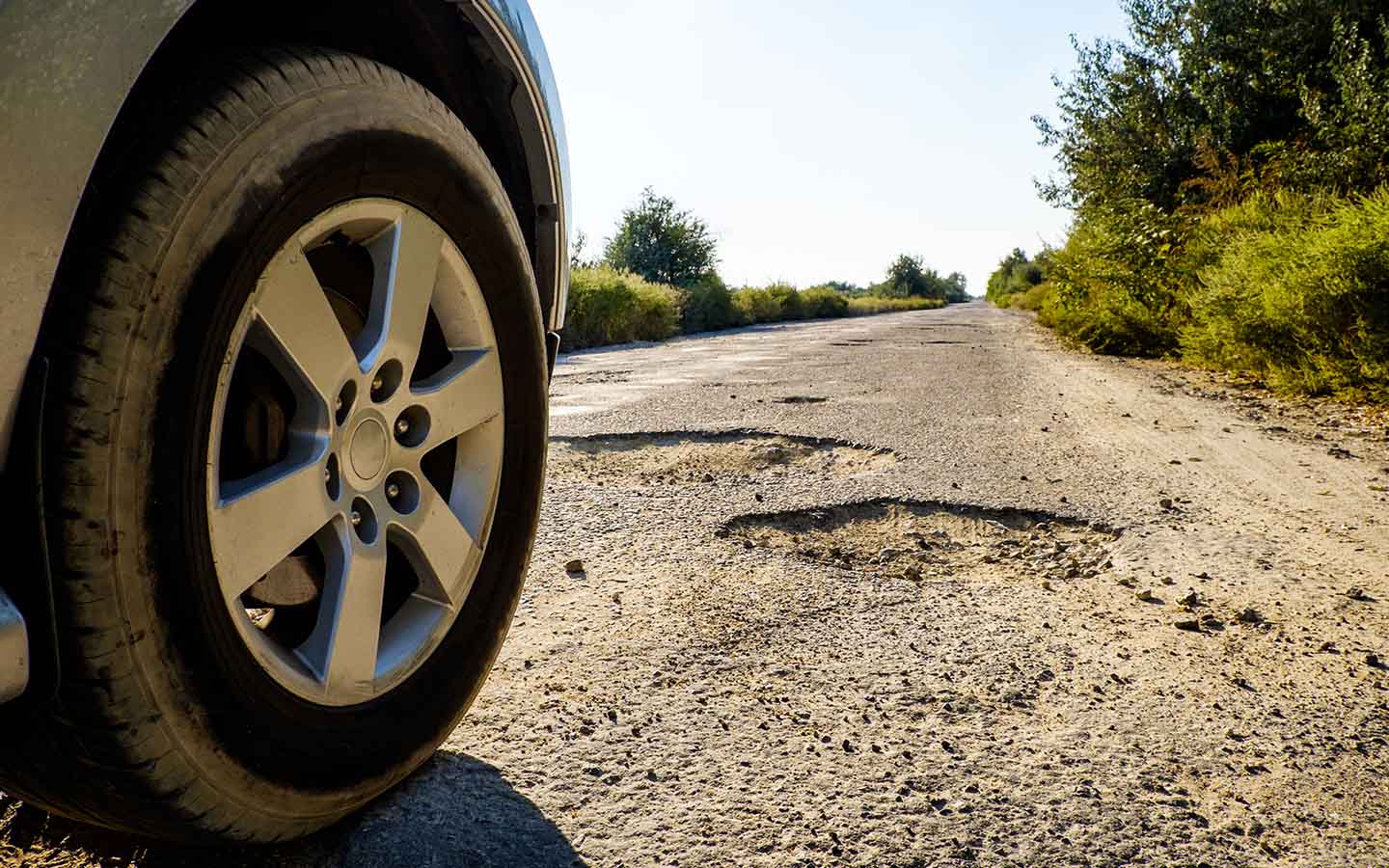 for Reducing vehicle suspension bounce , avoid driving on potholes