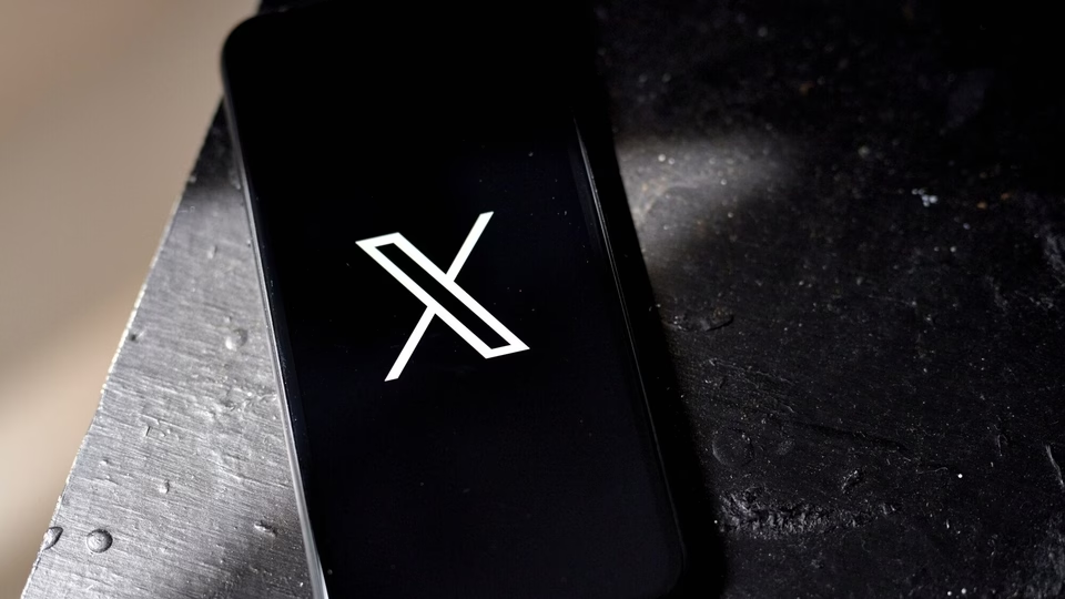 An image of a smartphone with the X logo, an application used for many functions including public relations.