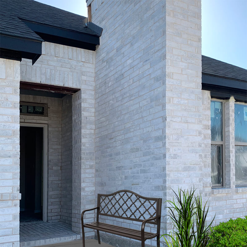 Bilco’s Mountain Peak Brick Makes for a Smokey White Exterior