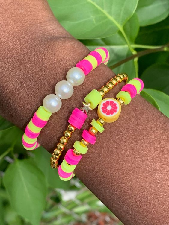 Clay bead bracelet ideas: Lady  shows off her with beads

