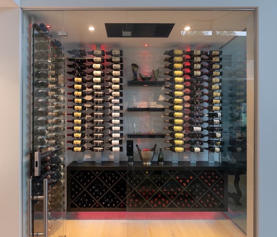 A wine cellar with many bottles of wine

Description automatically generated
