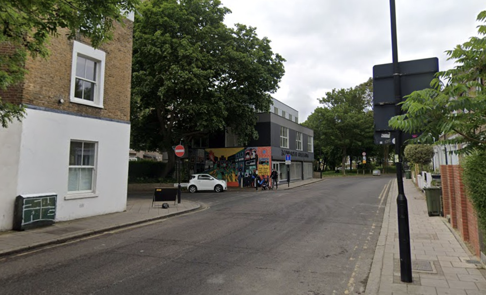 Google maps photograph of the intersection of Railton Road and Hurst Street showing a bright, colourful mural