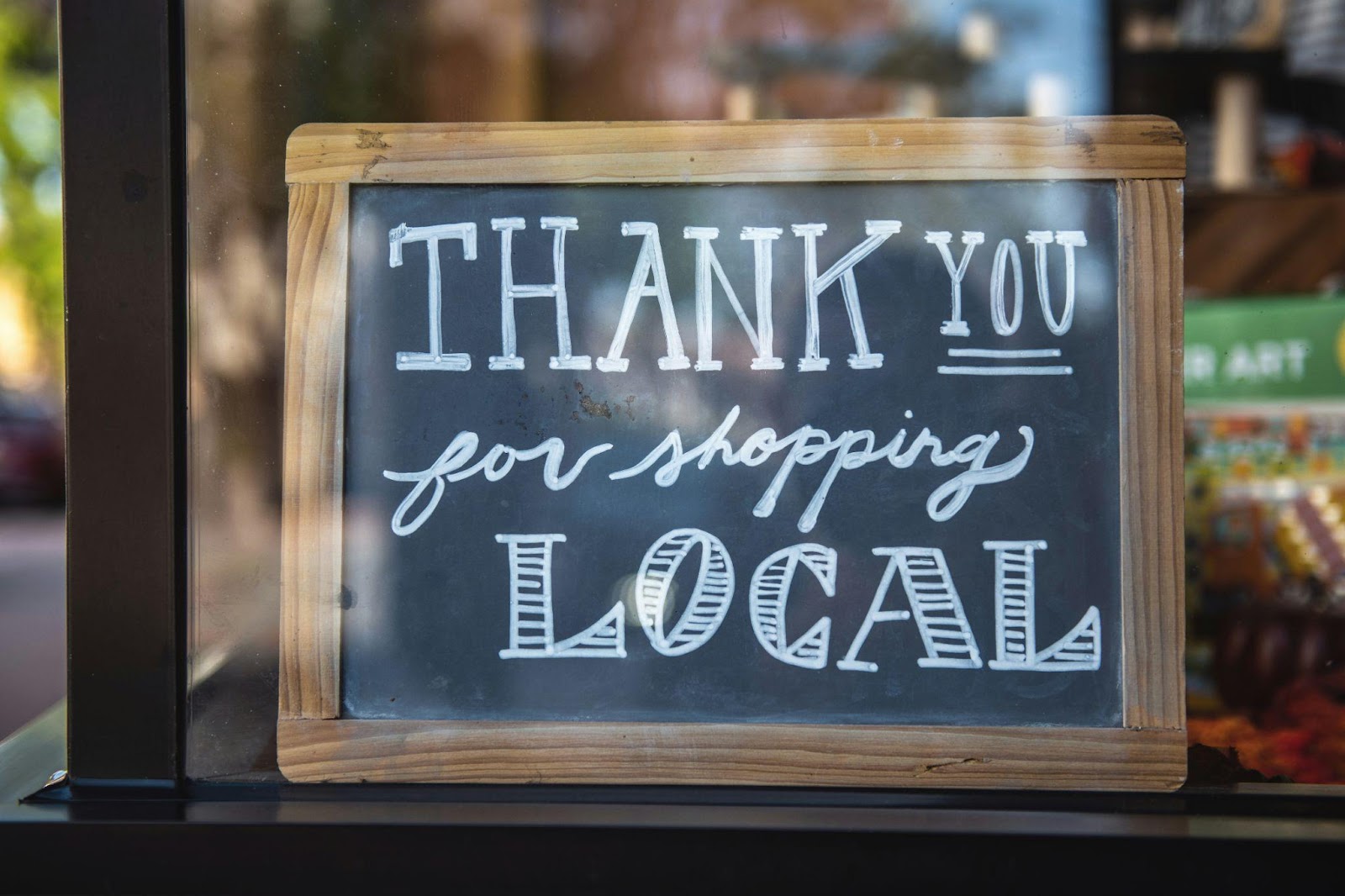 A signage written with a Thank You for shopping Local