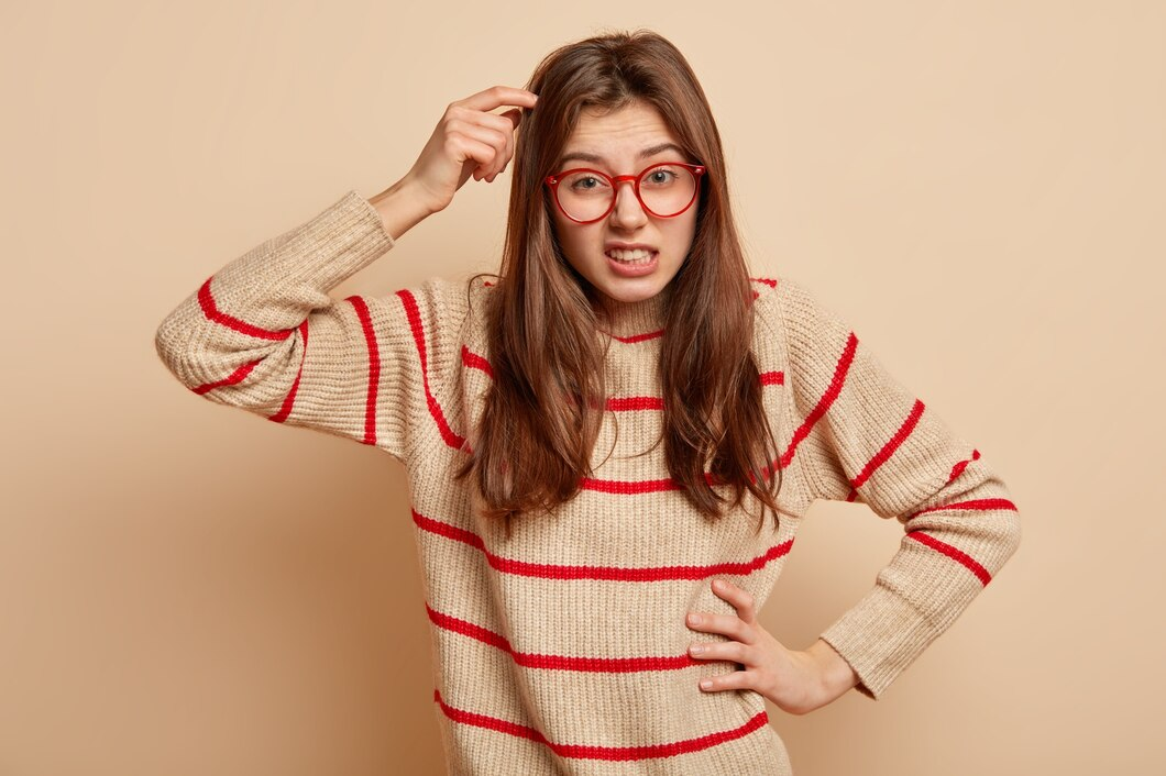 A woman with red glasses feeling sassy.