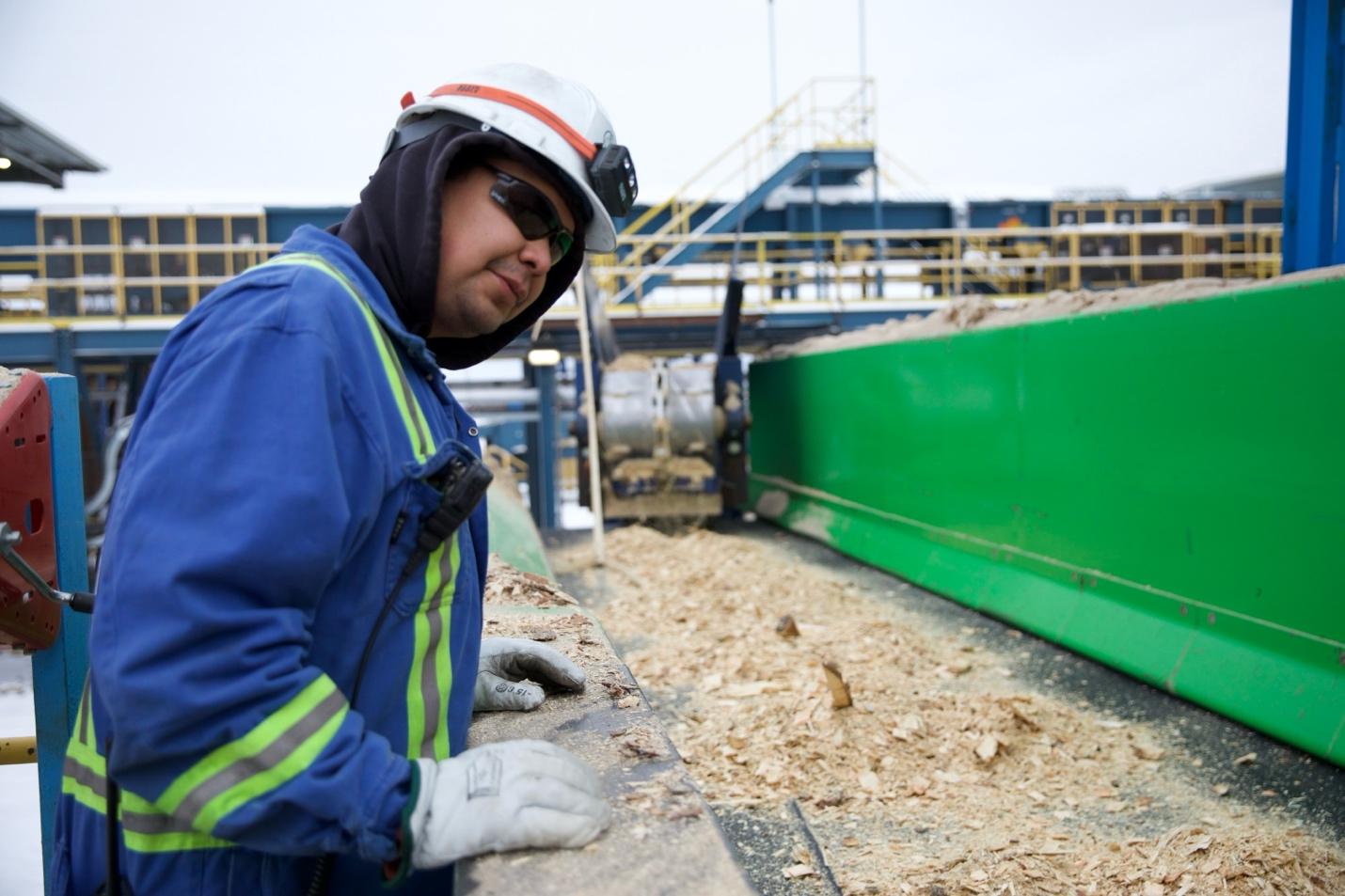 A person in a hard hat and hardhat

Description automatically generated