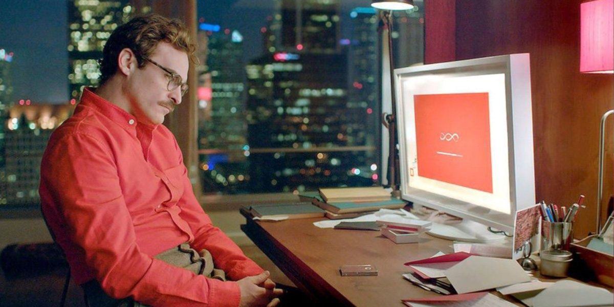 Joaquin Phoenix stares at a computer in Her