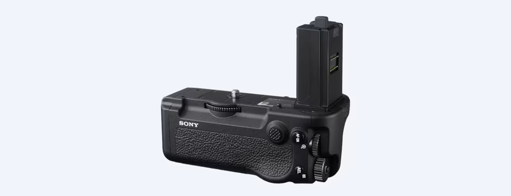 A black camera with a battery gripDescription automatically generated