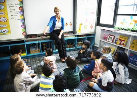 Teacher pointing at a student in class.