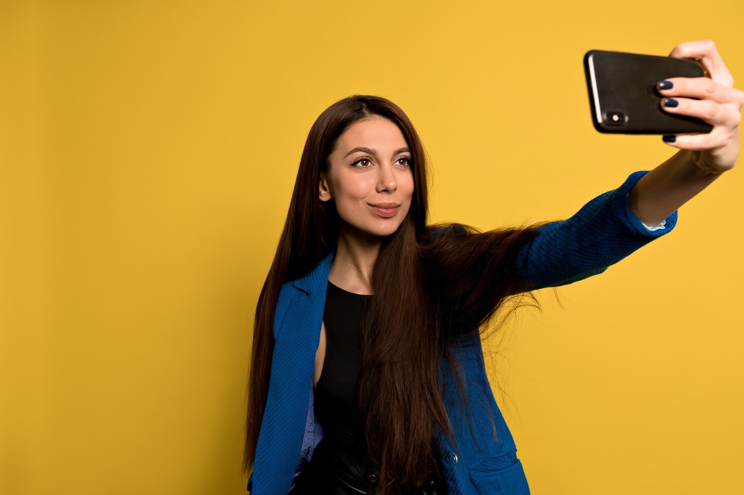 A woman taking a selfie.
