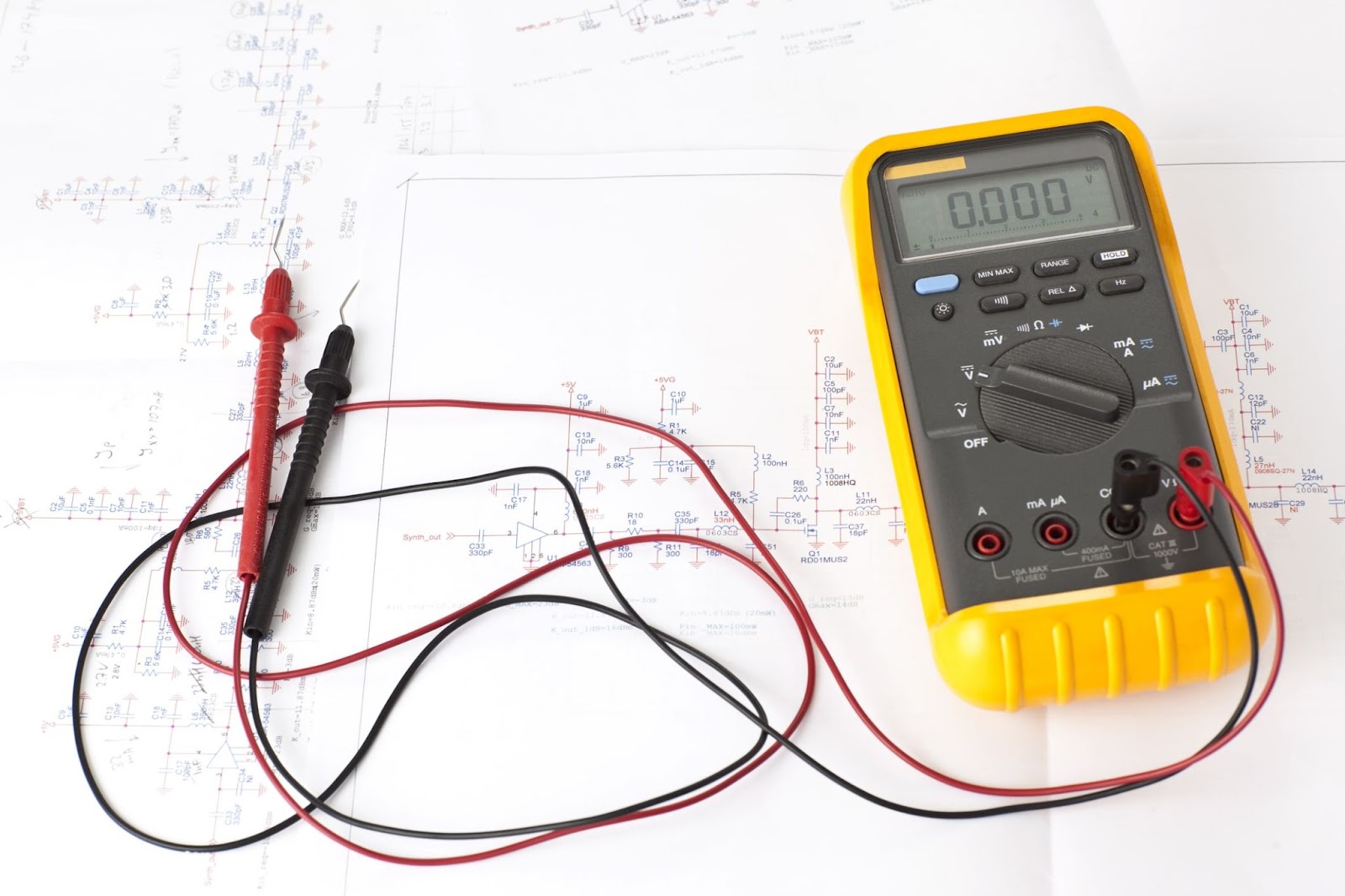 A multimeter laying on a diagram 