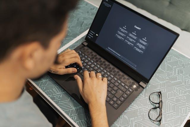 A man working on a laptop using chatgpt