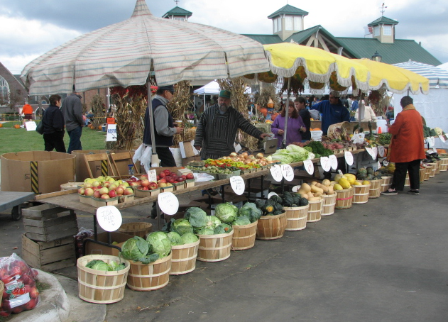 Farmer's market stall selling fruit and vegetables