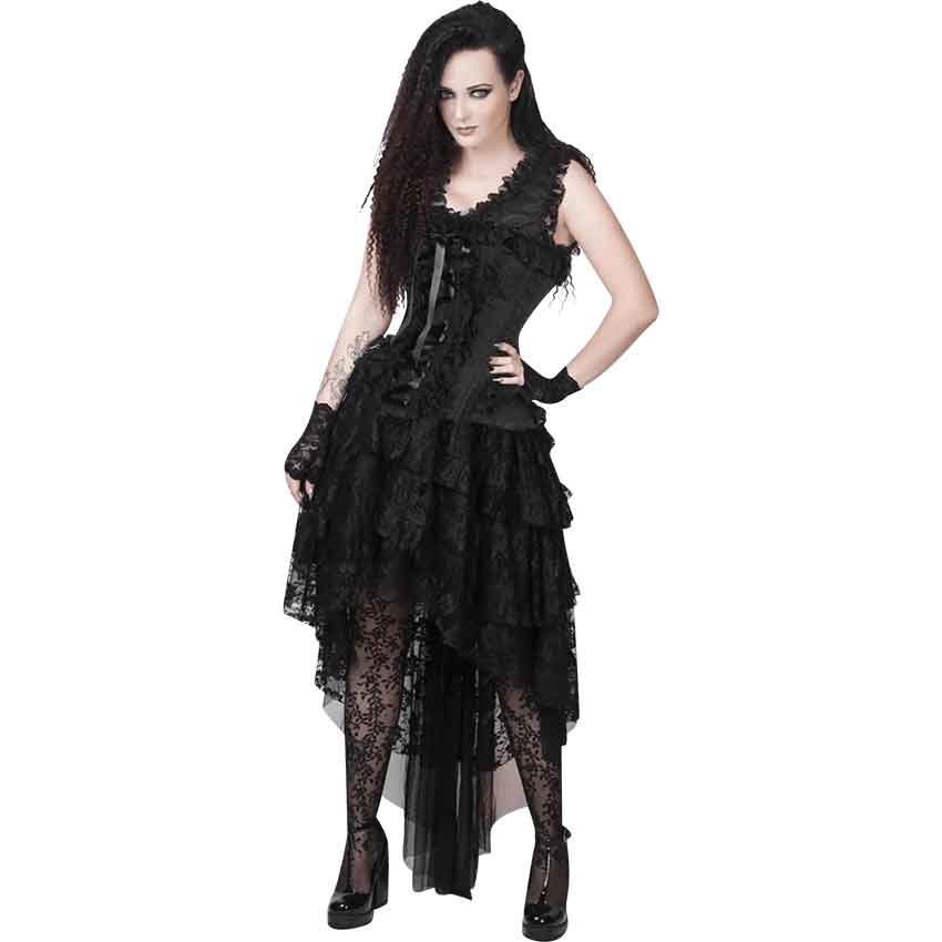Woman in black gothic dress with lace detailing posing against white background