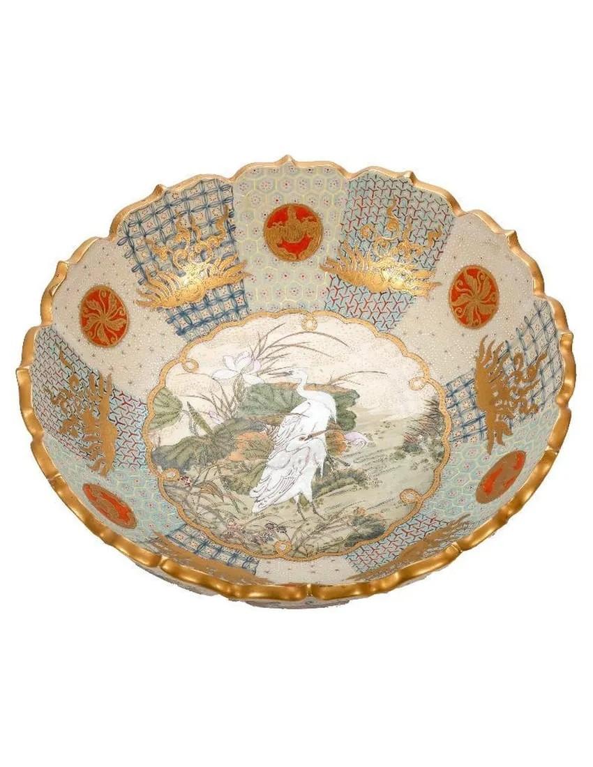 A bowl with a painting on it

Description automatically generated