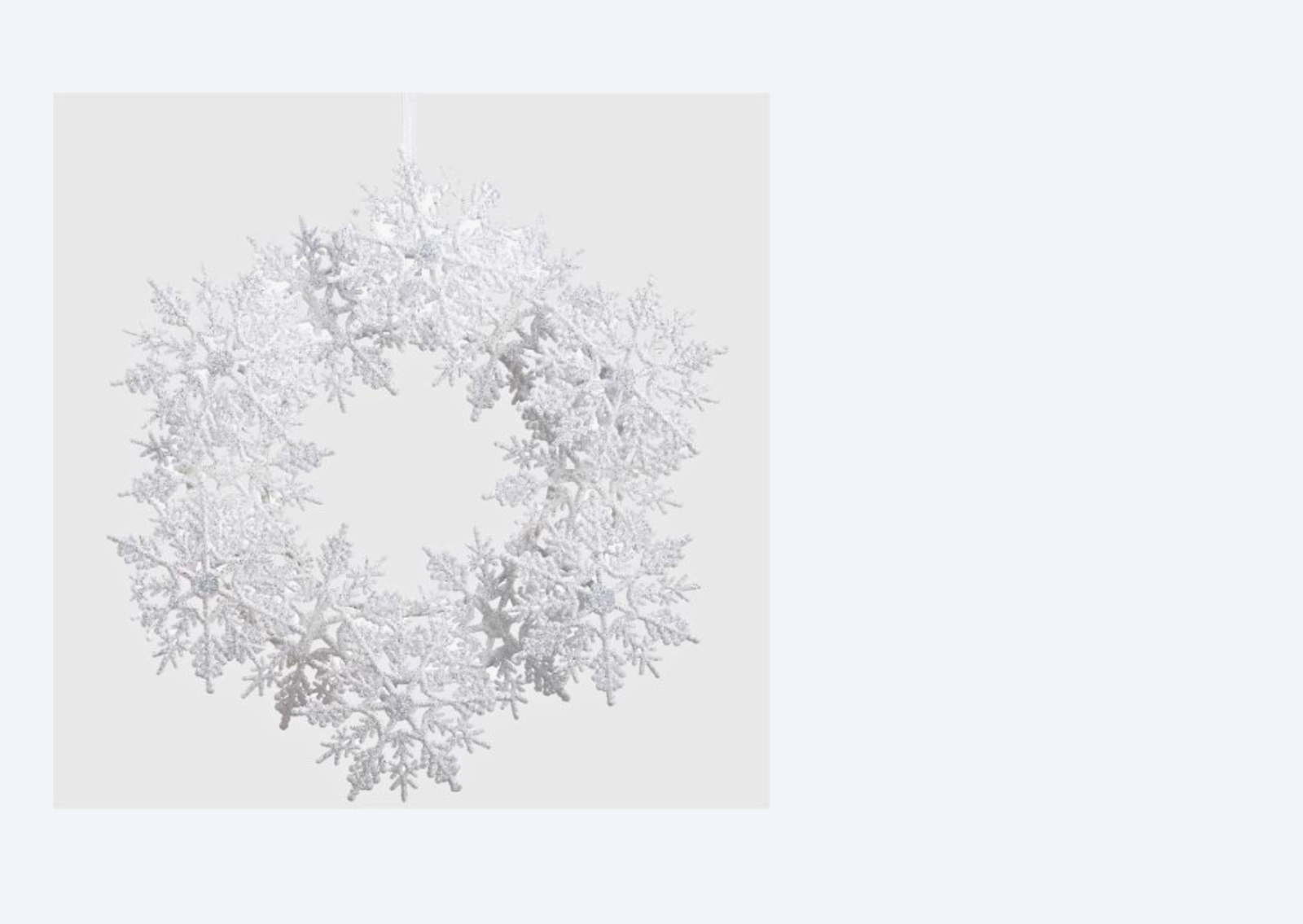  Immerse in the enchantment of the Ornament Wreath Glittered Snowed White 11". A snowy white masterpiece adorned with glittering ornaments, bringing a touch of winter magic to your holiday decor
